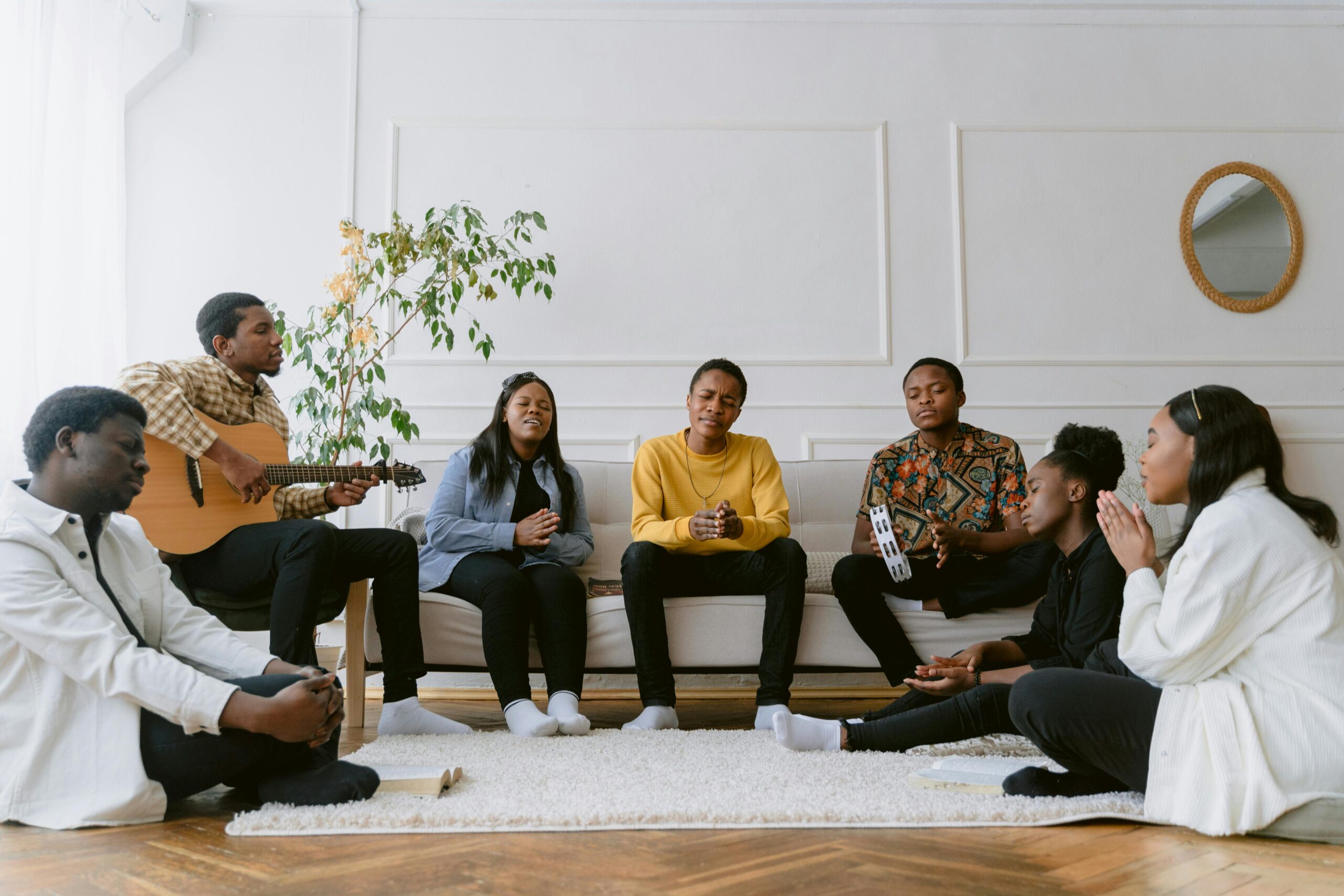 pexels-tima-miroshnichenko-6860844 group of young black christians sitting singing